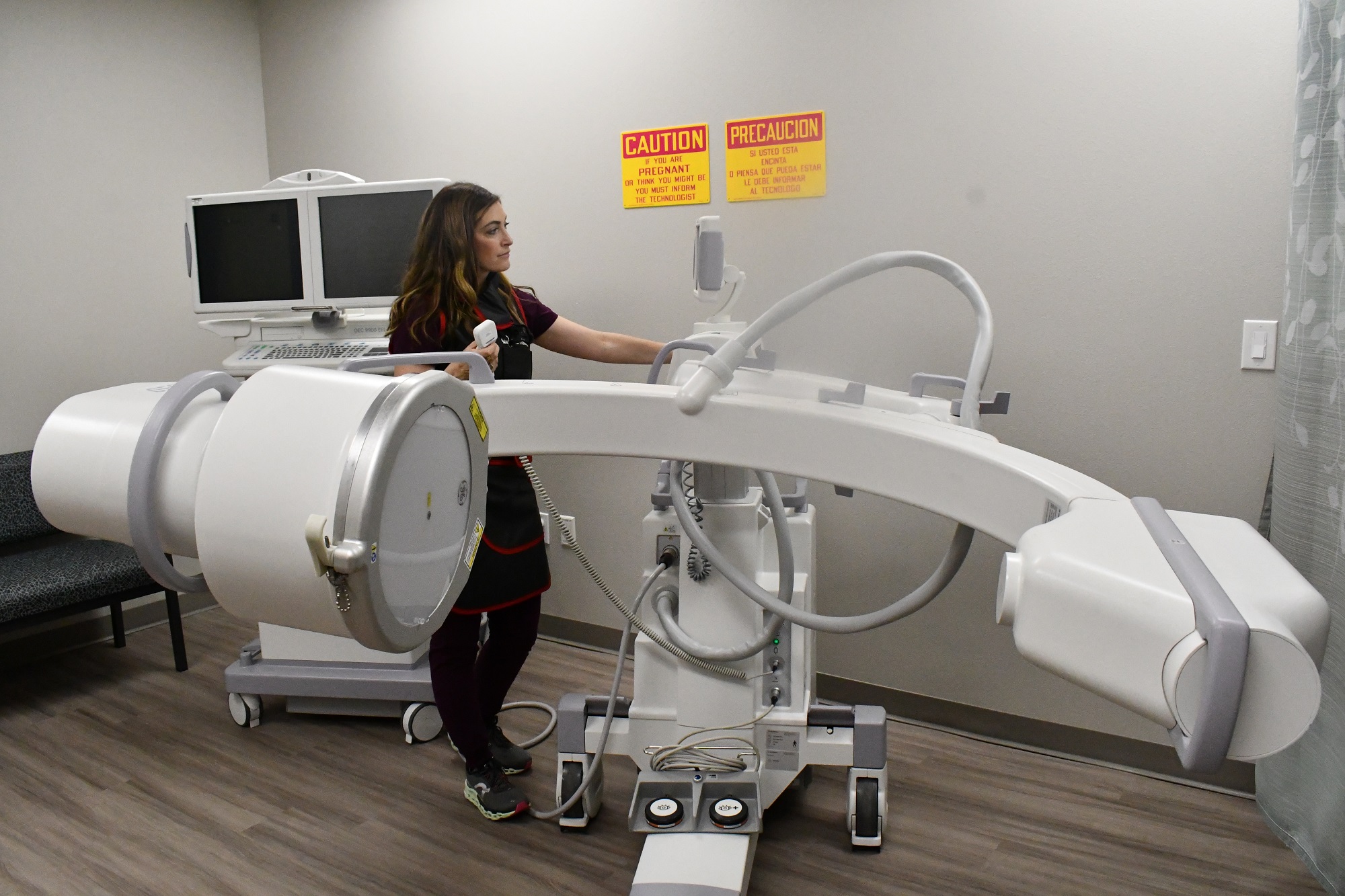 Photo of surgeon with c-arm imaging system at Hendrick Body and Wellness