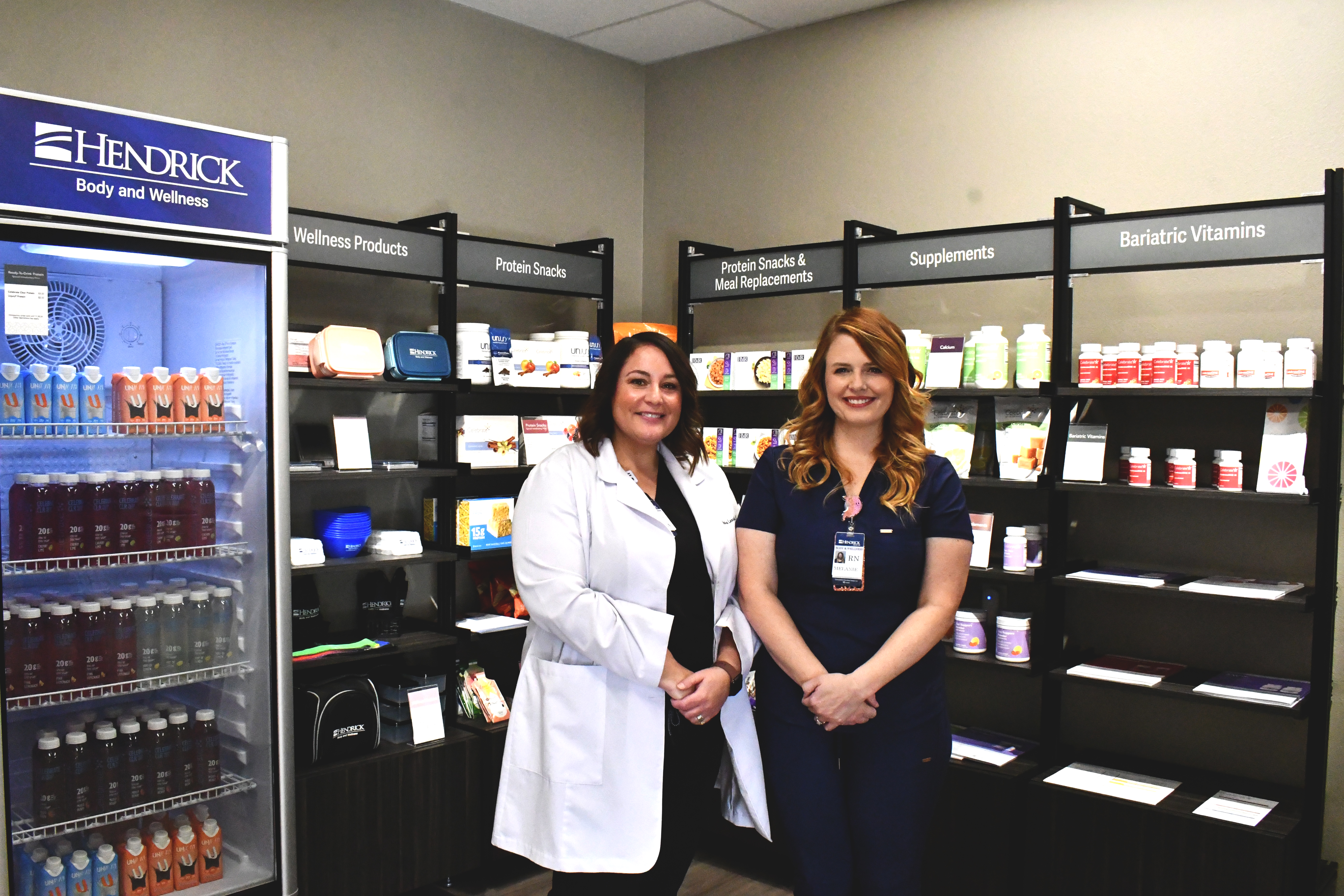 Photo of two Hendrick Body and Wellness providers in retail area 